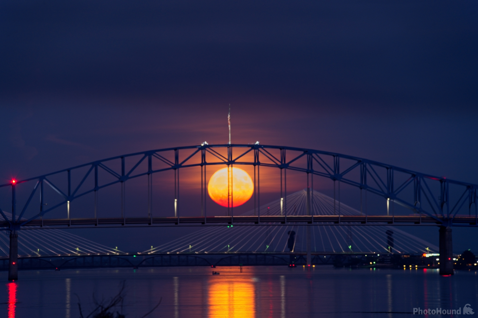The full moon rising above the bridges connecting Pasco and Kennewick across the Columbia River